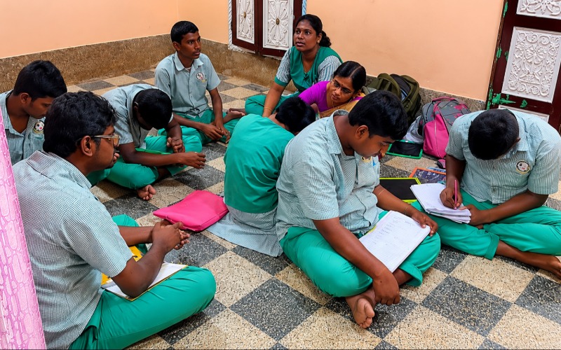 Students learning together in a circle